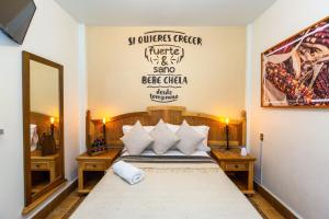 Letto o letti in una camera di Mala Vecindad Beer Hotel