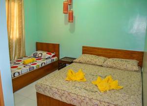 Tempat tidur dalam kamar di Terraza de Nino Resort