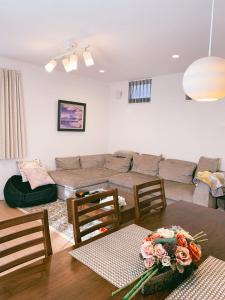 a living room with a couch and a table at Uhome Ikebukuro Villa 2 in Tokyo