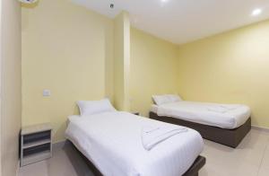Postel nebo postele na pokoji v ubytování Hotel Raja Bot