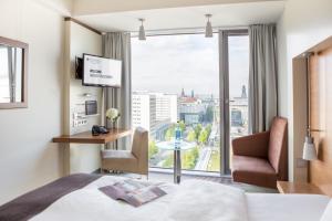 a hotel room with a view of the ocean at Pullman Dresden Newa in Dresden