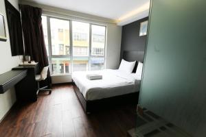 Voodi või voodid majutusasutuse Hotel 99 Bandar Klang (Meru) toas