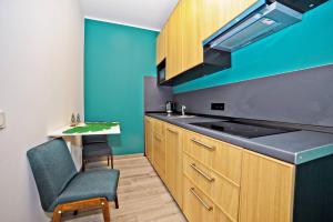 O bucătărie sau chicinetă la Grand Apartments - Superior Loft Apartment