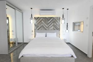 a bedroom with a large bed with white sheets at Suite dream in Eilat