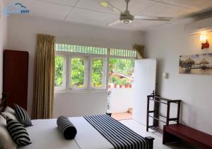 Postel nebo postele na pokoji v ubytování Cloud Inn Kandy Homestay - Kandy Perahera 2025