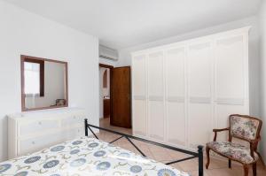 A bed or beds in a room at Primula 1