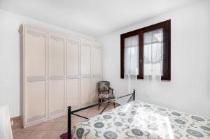 A bed or beds in a room at Primula 1