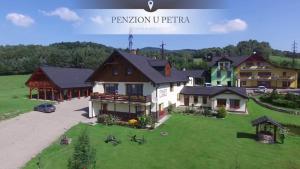 an aerial view of a house with a green yard at Penzion u Petra in Jeseník