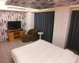 TV a/nebo společenská místnost v ubytování Love Hotel