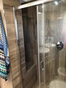 a shower with a glass door in a bathroom at La Suite del Mare in Taranto +26 photos