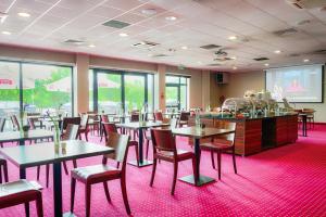 Reštaurácia alebo iné gastronomické zariadenie v ubytovaní Focus Hotel Katowice Chorzów