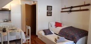 Postel nebo postele na pokoji v ubytování Apartments Vijolica