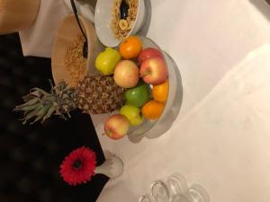 a bowl of fruit sitting on a table at The Craighaar Hotel in Aberdeen