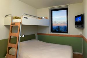 Postel nebo postele na pokoji v ubytování ibis budget Toulouse Aeroport