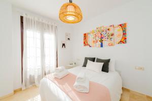 Llit o llits en una habitació de Apartamento Turístico La Vega