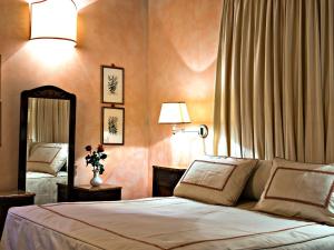 Postel nebo postele na pokoji v ubytování Villa Eleonora