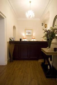 a room with a altar with a vase of flowers at The Westbourne in Bowness-on-Windermere