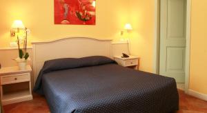 Voodi või voodid majutusasutuse Hotel Excelsior Splendide toas