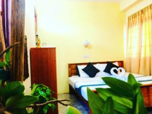 Postel nebo postele na pokoji v ubytování Randhi La Beach View Lounge