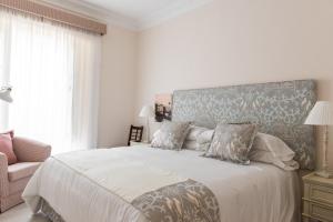 Łóżko lub łóżka w pokoju w obiekcie Suites de Franchy