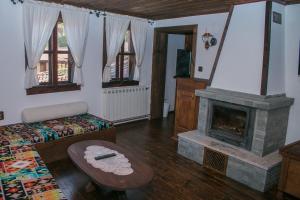 Postel nebo postele na pokoji v ubytování ЧОЛАКОВАТА КЪЩА