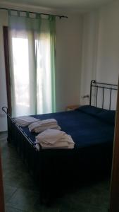 เตียงในห้องที่ Appartamento Simius