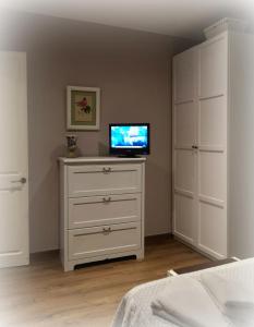 A television and/or entertainment centre at Apartment Sant Francesc