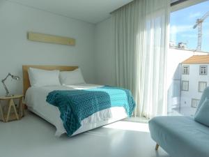 Uma cama ou camas num quarto em I Loft Porto