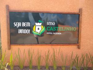 a sign on the side of a building with signs on it at Sitio Castelinho in Cesário Lange