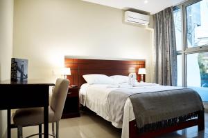 Posteľ alebo postele v izbe v ubytovaní LC Hoteles Piura