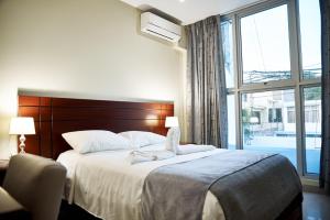 Posteľ alebo postele v izbe v ubytovaní LC Hoteles Piura