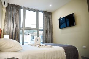 Posteľ alebo postele v izbe v ubytovaní LC Hoteles Piura