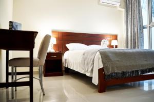 Posteľ alebo postele v izbe v ubytovaní LC Hoteles Piura