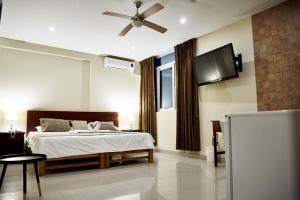 Posteľ alebo postele v izbe v ubytovaní LC Hoteles Piura