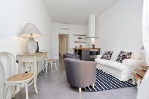 a living room with a couch and a table at Monti charming apartment - Rome short let Service in Rome