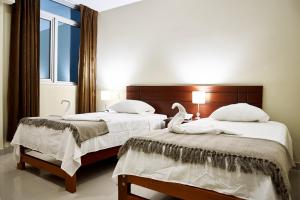 Posteľ alebo postele v izbe v ubytovaní LC Hoteles Piura