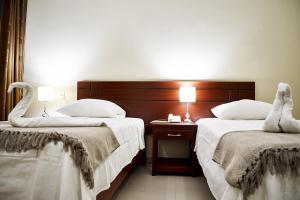 Posteľ alebo postele v izbe v ubytovaní LC Hoteles Piura