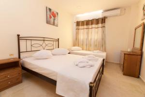 Postel nebo postele na pokoji v ubytování Lagoon view apartment - Orange Guest House