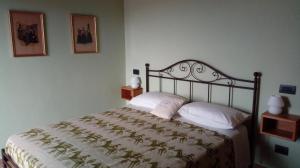 Postel nebo postele na pokoji v ubytování B&B PIBITZOI