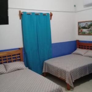 Un ou plusieurs lits dans un hébergement de l'établissement Hotel Chaac Calakmul