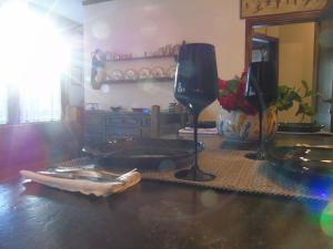 a table with two wine glasses on top of it at Hs4U Chalet sulle piste - Dolomiti - Madonna di Campiglio in Madonna di Campiglio +13 photos