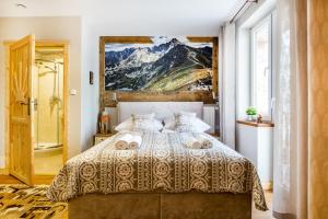 Posteľ alebo postele v izbe v ubytovaní Pałac Tatrzański Apartamenty