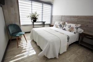 Postel nebo postele na pokoji v ubytování ARI Hotel