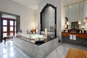 a large bathroom with a large marble counter top at Taj Falaknuma Palace in Hyderabad