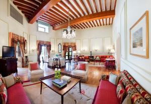 a living room with a couch and a table at Taj Falaknuma Palace in Hyderabad