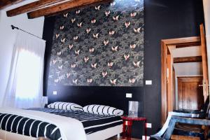 A bed or beds in a room at Casa Corte delle Ancore
