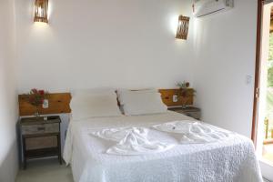 Кровать или кровати в номере Pousada Amor de Casa