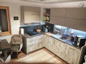 a kitchen with a sink and a counter top at Appartement Mountain Lake in Maurach