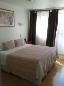 Ένα ή περισσότερα κρεβάτια σε δωμάτιο στο Hotel Real