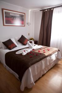 Ένα ή περισσότερα κρεβάτια σε δωμάτιο στο Hotel Real